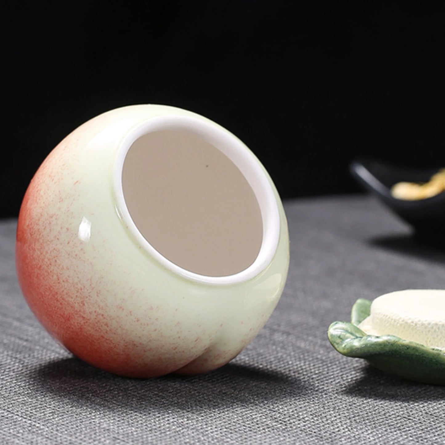 Creative design small portable ceramic peach tea canister: high quality sealing, can keep fresh for puerh tea.