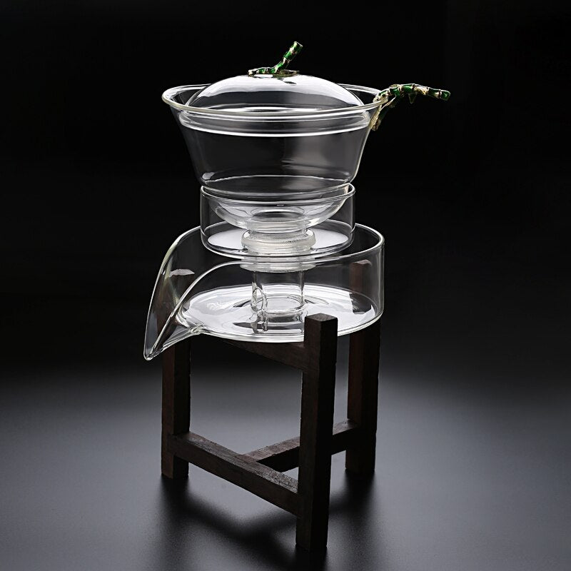 Juego de té de vidrio resistente al calor de la cubierta giratoria de agua de agua