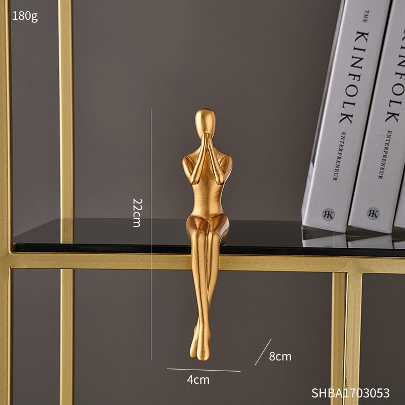 Abstrakti kultainen veistos ja hahmot sisätilojen hartsihahmo patsas moderni kodinsisustuslaitteet
