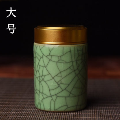 Керамический чайный кэдди с металлической крышкой.