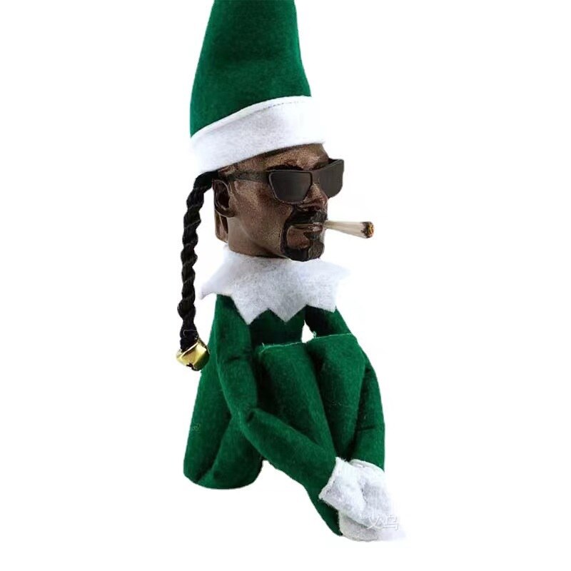 Creative Snoop su una bambola elfo di Natale scottata spia su una decorazione natalizia piegata a casa ornamenti in lattice giocattoli
